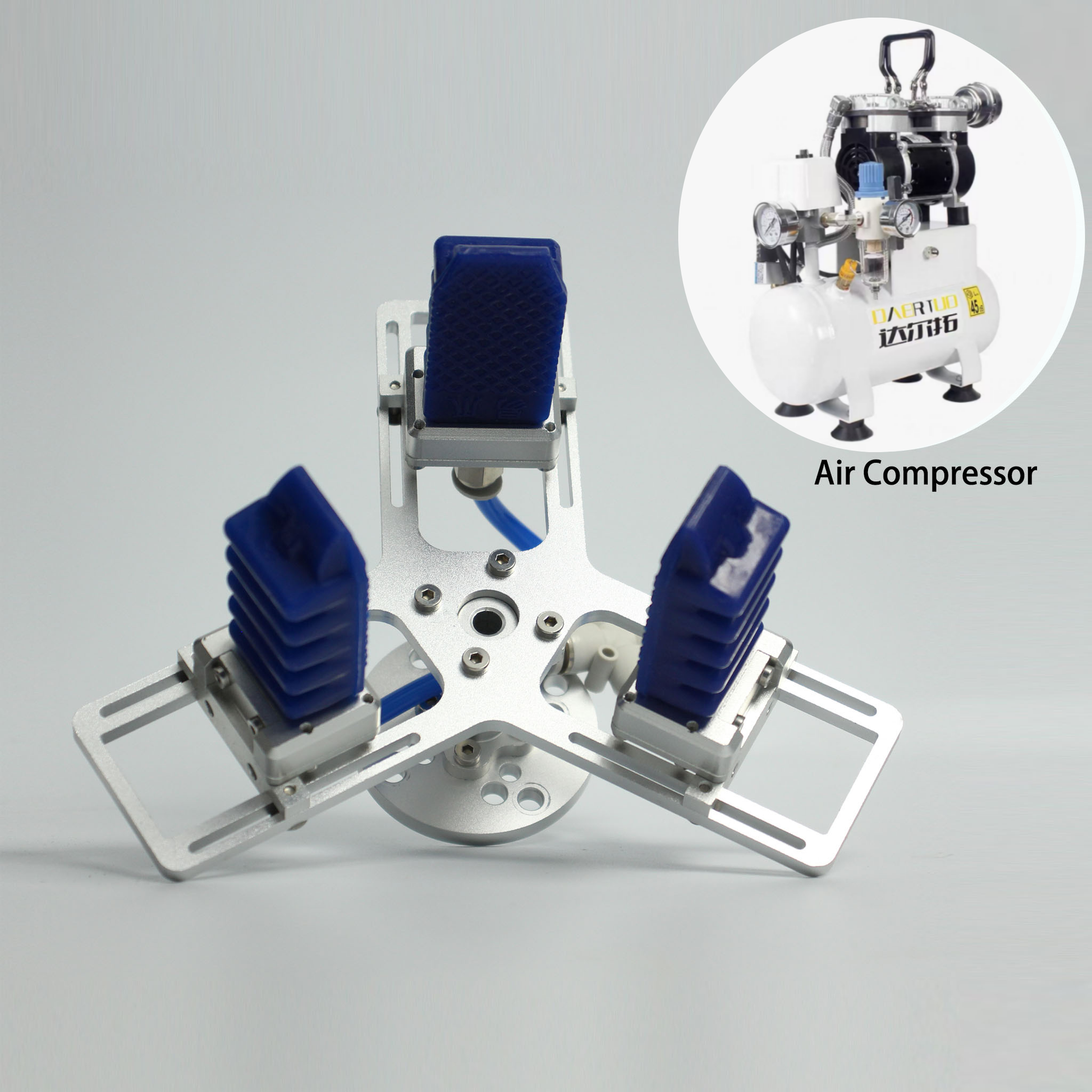 soft Gripper on a gray background, inset with an air compressor.